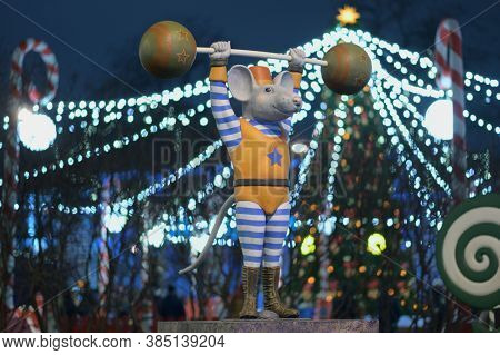 St. Petersburg, Russia - December 14, 2019: Statue of circus mouse on the New Year and Christmas Fair on Manege square. More than 20 statues of mouses symbolizing the Chinese year of mouse was install