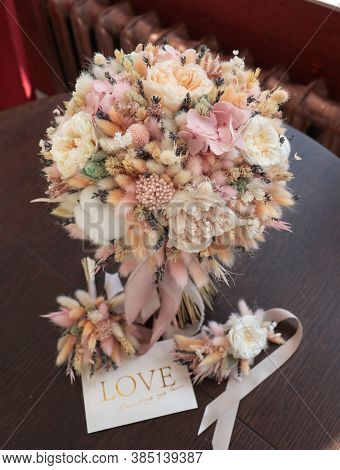 Stylish Bridal Bouquet Of Preserved Flowers And Lagurus With Boutonniere. Dried And Preserved Flower