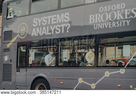 Oxford, Uk - August 04, 2020: View From The Street Of People In Protective Face Masks On A Bus In Ox