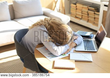 Tired Overworked Woman Resting While She Was Working On Laptop.