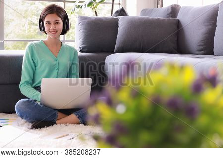 Young And Beautiful Cute Woman Half Race Thai-german Wearing Headphone And Using Laptop Notebook Com
