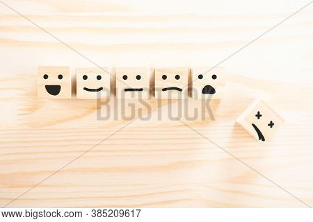 Wooden Cubes That Express Different Emotions. Smile Face Icon Symbol On Wooden Cube On Wooden Backgr