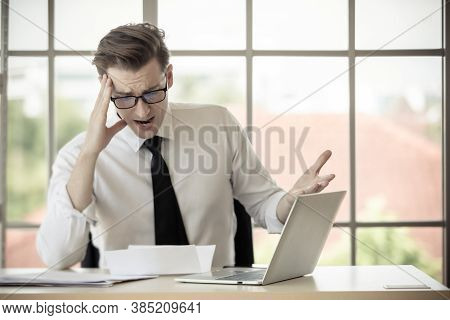 Young Caucasian Businessman Wearing Eyeglasses Feel Shocked And Afraid When Read Letter Of Get Fired