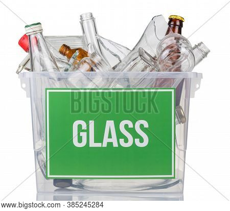 Recycling Concept. Container With Glass Waste, Various Jars And Shards Isolated On White Background