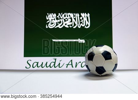 Small Football On The White Floor And Saudi Arabian Nation Flag With The Text Of Saudi Arabia Backgr