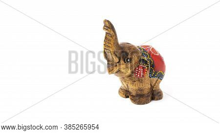 Figurine Of A Wooden Elephant With Pattern On The Back Isolated On White Background. Decorative Figu