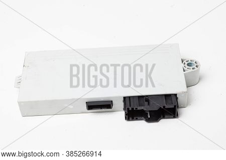 Plastic Control Unit Of A Car Engine With Black Elements On A White Isolated Background - The Connec