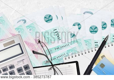 100 Czech Korun Bills And Calculator With Glasses And Pen. Tax Payment Concept Or Investment Solutio