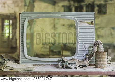 Pripyat, Ukraine, August 2020: Broken Tv And Gas Mask In Prypyat