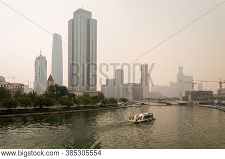 Tianjin / China - August 3, 2014: Downtown Tianjin, Tianjin Financial Center And Hai River On A Smog