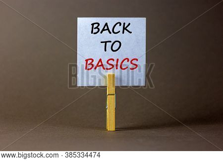 White Paper With Text 'back To Basics', Clip On Wood Clothespin. Beautiful Grey Background. Business