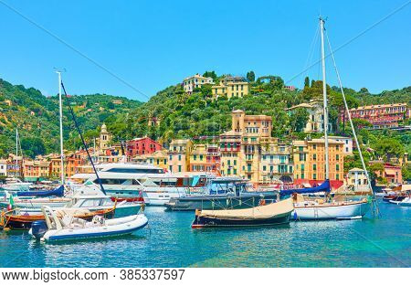 Small potr with yachts and boats in Portofino, Italy. Portofino is a  luxury resort on the Italian riviera in Liguria