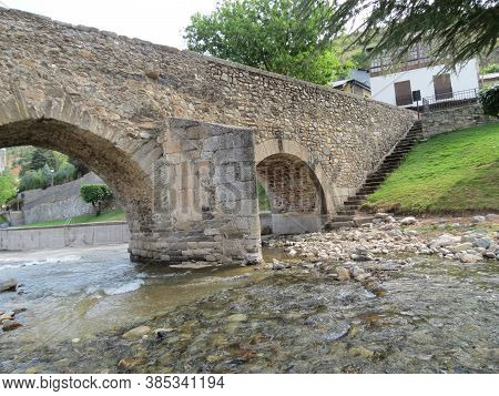 Ancient Roman Bridge Over Meruelo River In Molinaseca, Leon, Spain. Camino De Santiago Goes There.