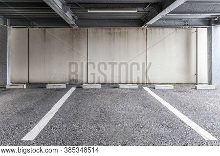 Empty Small Parking On The Ground Floor Below The Apartment Building