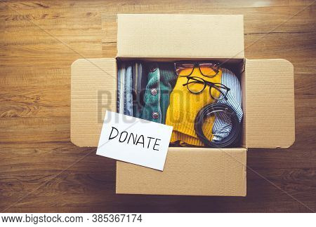 Donation Concepts With Accessories Clothing In Packing Box.giving And Sharing With Human.second Hand