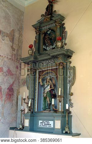 PETROVINA, CROATIA - JULY 22, 2013: Altar of Saint Michael in the parish church of Saint Peter in Petrovina, Croatia