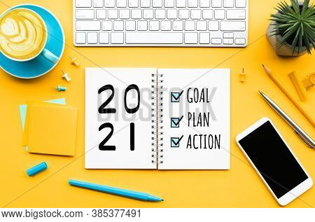 2021 New Year Goal,plan,action Text On Notepad With Office Accessories.business Management,inspirati