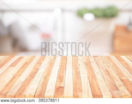 Wood Table Top On Blur Kitchen Counter (room)background.for Montage Product Display Or Design Key Vi