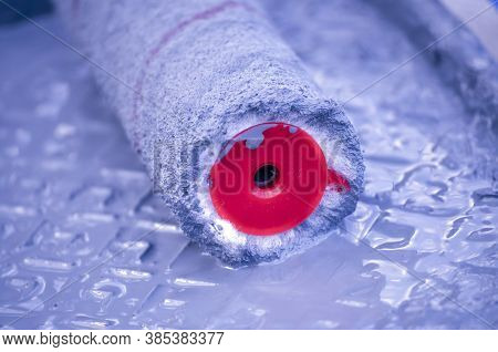 Fibers Of A Paint Roller In A Tray With Fresh Purple Paint, Close Up