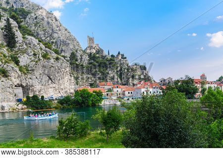 View Of Cetina River And The Tower Mirabella . Sunny Day, Clouds. Omis, Croatia.