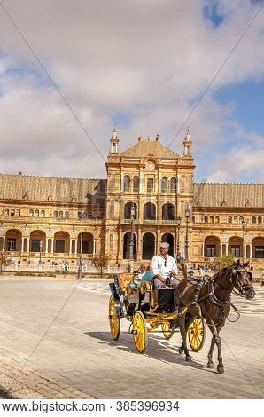 Seville, Spain - June Circa, 2020. Tourist Ride In Horse Carriage By The Plaza De Espana ,square Of 
