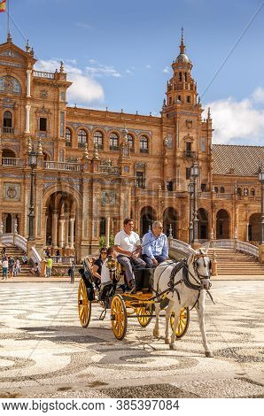 Seville, Spain - June Circa, 2020. Tourist Ride In Horse Carriage By The Plaza De Espana ,square Of 