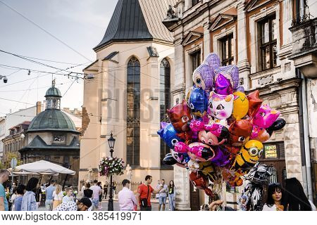 Lviv, Ukraine - September 12, 2020: Old City Center With Cartoon Balloons And Ancient Church On The 