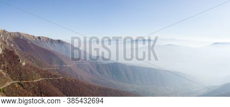Scenic Panoramic View From The Mountain Vlasic, A Valley Filled With Fog And Peaks Above The Fog In 