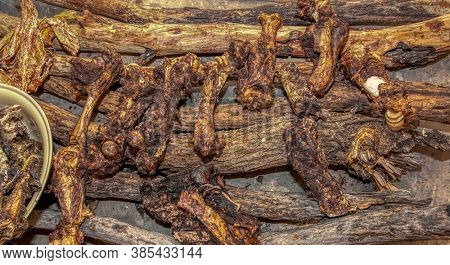 dry meat on the bones sited on logs in a village in botswana
