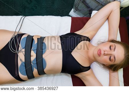 Myostimulation Electrodes Are Installed On The Abdomen. Anticellulite Massage Myostimulation For A B