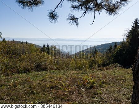 Scenic View From The Mountain Kozara On The Fog-filled Valley During A Sunny Day.