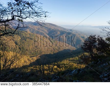 Scenic View From The Slope Of The Kozara Mountain Overgrown With Forest During A Sunny Day Against T