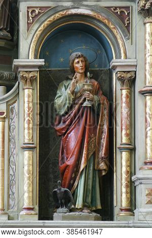 SVETI IVAN ZELINA, CROATIA - JUNE 26, 2013: Saint John the Evangelist statue on the altar at Our Lady of Sorrows parish church of Saint John the Baptist in Sveti Ivan Zelina, Croatia