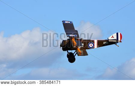 Ickwell, Bedfordshire, England - September 06, 2020: Vintage  Sopwith Triplane  In Flight Blue Sky A