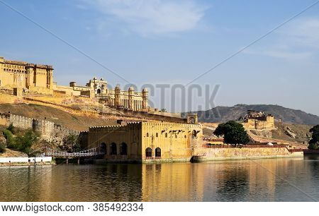 View Of Part Of The Ancient Amber Fort, Walls, Gates And Adjoining Building With Bridge From The Mao