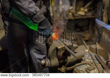 Professional Blacksmith Working With Metal - Quenching Hot Iron Part With Water At Forge, Workshop. 