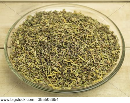 Dry Thyme In A Glass Plate On A Wooden Background