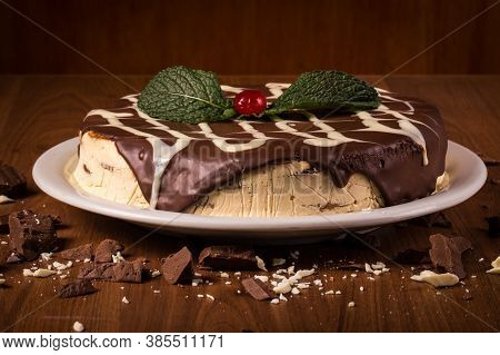 Cream Cake With Biscuit And Chocolate Syrup On The Wooden Background. In Brazil It Is Called Torta A
