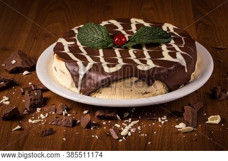 Cream Cake With Biscuit And Chocolate Syrup On The Wooden Background. In Brazil It Is Called Torta A