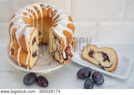 Typical German Poppy Seed Plum Gugelhupf Cake On A Table