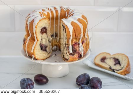 Typical German Poppy Seed Plum Gugelhupf Cake On A Table