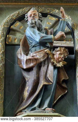 SVETI IVAN ZELINA, CROATIA - JUNE 26, 2013: Saint Matthew the Evangelist statue at the pulpit in the parish church of Saint John the Baptist in Sveti Ivan Zelina, Croatia