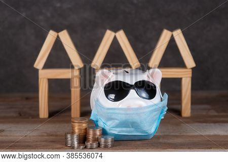 Pandemic Real Estate Crisis. Masked Piggy Bank