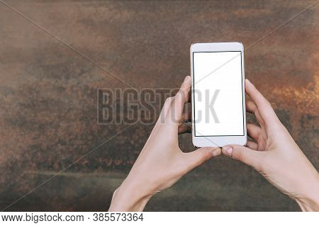 Close-up, Mockup Of A White Smartphone, In The Hands Of A Girl.