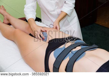 Myostimulation Electrodes Are Installed On The Abdomen. Anticellulite Massage Myostimulation For A B