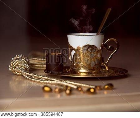 A Golden Coffee Cup And Jewelry On The Table, Chocolate, Luxurious Elegance Style Concept