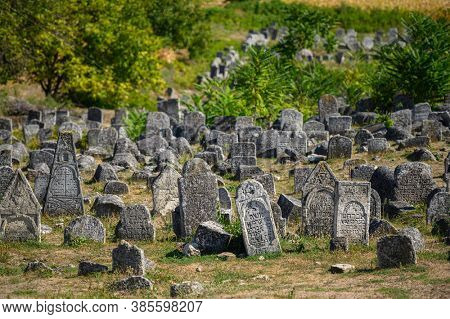 Vadul Rascov, Soldanesti, Moldova, September 2020: Old ruined tombstones at the ancient Jewish cemetery, now abandoned. Jewish communuty was massacred by nazis during WW2.