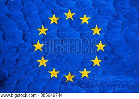 Eu Flag On Texture Background. Background For Greeting Cards For Eu Public Holidays. Europe Day Is C
