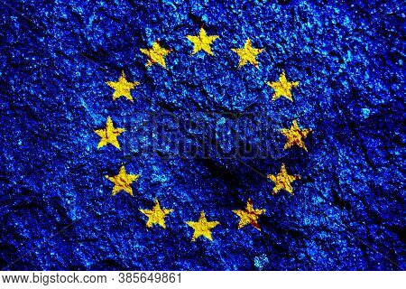 Eu Flag On Texture Background. Background For Greeting Cards For Eu Public Holidays. Europe Day Is C