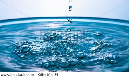 Abstract An Outbreak Of Water. Splash Of Water Close-up. Frozen Water Drop Photographed At High Spee